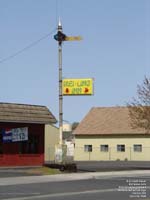 An old railroad signal is used as a sign by a Connell chinese restaurant